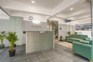 an office lobby with a zebra sign on the wall at Hotel Zenora in Méribel Village