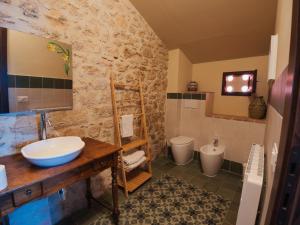 a bathroom with a sink and a toilet at B&B Manca1Fiorino in Spoleto +20 photos