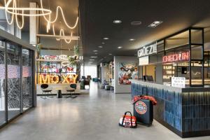 a store front of a store with a bakery at Moxy Zurich in Zurich