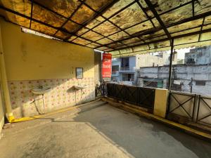 an empty room with sinks on the wall of a building at Shivangi hotel in Bareilly