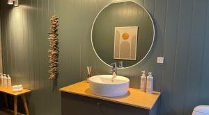 a bathroom with a white sink and a mirror at Als Kloster in Sønderborg +30 photos
