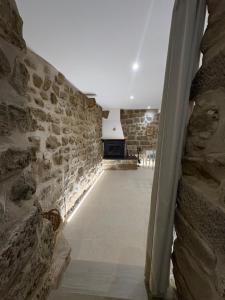 a hallway of a stone building with a stone wall at Casa Brillantes in Ayerbe