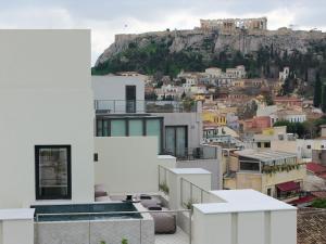 a view of the city from the roof of a house at Bellén Athens Ηotel in Athens