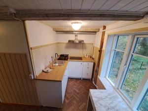 a small kitchen with a sink and a counter at Parkal Apartments in Paide