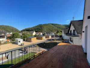 a view from the balcony of a house at Relaxen am Waldesrand Fewo 2 in Ahrbrück +2 photos