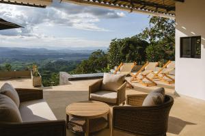 a patio with chairs and a table and a view at Casa Margarita Loft in Buenavista