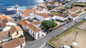 an aerial view of a town next to the ocean at Casa da Arvore Chale by Green Vacations in Calhetas