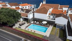 an aerial view of a house with a swimming pool at Casa da Arvore Chale by Green Vacations in Calhetas