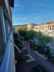 a view of a street from a window of a building at le victoire in Fréjus