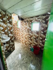 a room with a stone wall with a sink at NV Anjali Homestay in Sukhia Pokhari