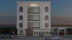 a rendering of a hotel with cars parked in front at Hotel Shiv Om in Ujjain