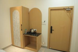 a room with a counter next to a door at Hotel Shiv Om in Ujjain