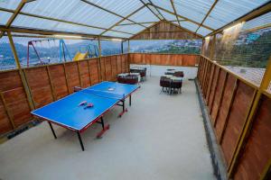 a group of ping pong tables in a tent at Tulips Resorts - Elkhill in Ooty