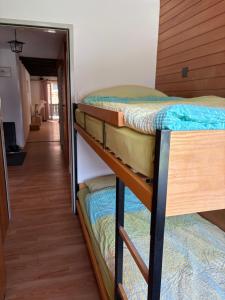 two bunk beds in a room with a hallway at Salü 5 in Saas-Fee +2 photos