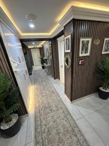 a hallway with wooden walls and a carpet at B Corner Hotel Bistro in Istanbul