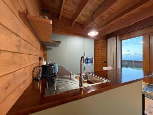 a kitchen with a sink and a counter top at Sunset Eco Shelter 5 in Ponta do Pargo