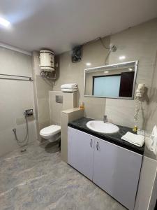a bathroom with a sink and a toilet at MJ Funcity Water Park & Resort in Lucknow