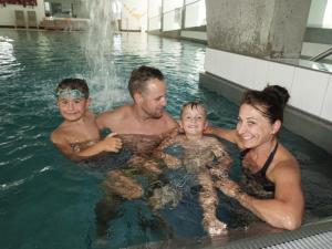 a group of people in a swimming pool at Dorfstube in Holzgau