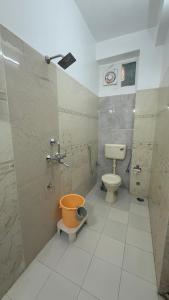 a small bathroom with a toilet and a sink at Elysium Retreat- The Heritage Haveli in Udaipur +35 photos