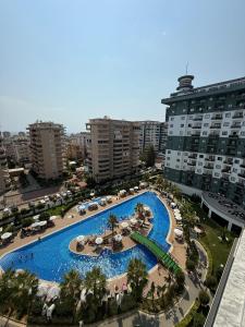 an aerial view of a large swimming pool in a city at Serenity Residence lux1plus1 in Alanya