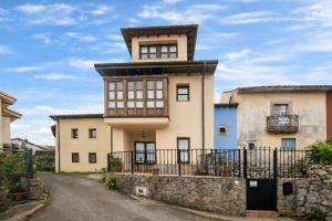 an old house with a tower on top of it at Poo de Llanes Casa cerca de la Playa – El Balandro in Llanes