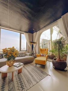 a living room with a couch and a table at The View Boutique Hotel in Vung Tau