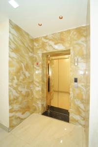 a hallway with a elevator in a building at Hotel Yash Palace in Agra +28 photos