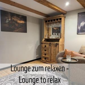 a living room with a couch and a table at Lokschuppen - Backstein-Loft in Bad Oeynhausen +8 photos