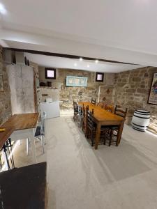 a large dining room with a table and chairs at Casa Brillantes in Ayerbe +34 photos