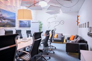a conference room with a table and chairs at Original Sokos Hotel Vaakuna Vaasa in Vaasa
