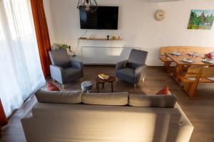 a living room with a couch and a table at Kuća za odmor Marija in Gospić