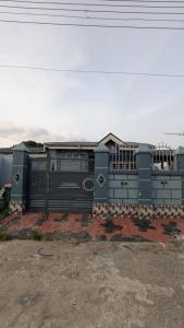 a blue train car sitting in a lot at Lux 3bedroom apartment in Okunola