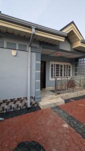 a house with a porch and a balcony at Lux 3bedroom apartment in Okunola