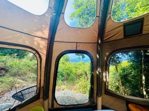 a view of the inside of a tent with three windows at Casita Orquidea in Resolution