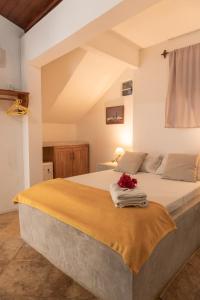 a bedroom with a large bed with flowers on it at casa jasmin in Jericoacoara