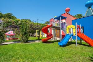 a playground with a slide and a play structure at Alder Resort Hotel -Ultra All Inclusive in Kemer