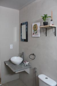a bathroom with a bowl sink on a counter at Mirabela Casa con vista panorámica a las sierras en Bialet Massé- Hasta 4 personas in Bialet Massé +42 photos