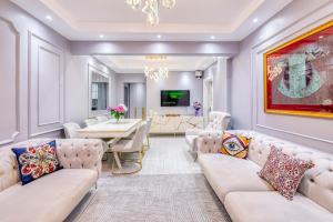 a living room with couches and a dining room at Bright Apart Hotel in Istanbul
