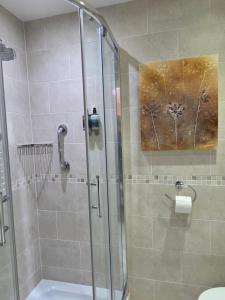 a bathroom with a shower with a glass door at The Cairn at North Lodge, Rural Guest Suite in Kirriemuir +43 photos