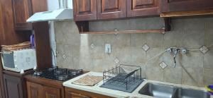 a kitchen with a stove and a counter top at El limonero in Paso de los Libres