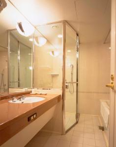 a bathroom with a sink and a shower at Hotel Okura Kyoto in Kyoto