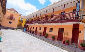 a street in an old town with buildings at Anais y Nicolas Cusco in Cusco +19 photos