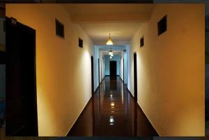 a hallway of a building with a long corridor at Nature Quite in Vattavada +1 photo