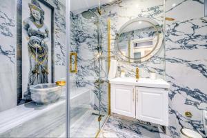 a bathroom with a sink and a mirror at Bright Apart Hotel in Istanbul +135 photos