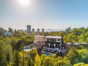 an aerial view of a building with trees at Gantiadi Holiday - Pool and Houses in Batumi