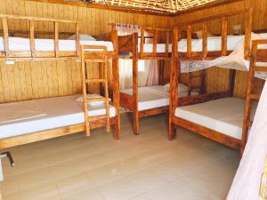 a room with a bunch of bunk beds at Sawa Sawa Beach Hotel&Backpacks in Malindi