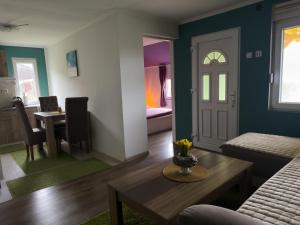 a living room with a couch and a table at Vila Jotic, Zavojsko jezero in Pirot