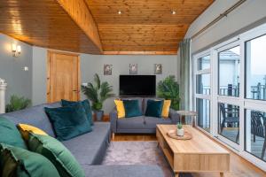 a living room with a couch and a table at Shannon View Jungle House in Athlone