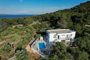 an aerial view of a house with a swimming pool at Villa Mauro in Božava