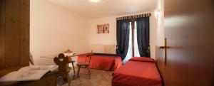 Postel nebo postele na pokoji v ubytování Hotel Residence Chateau